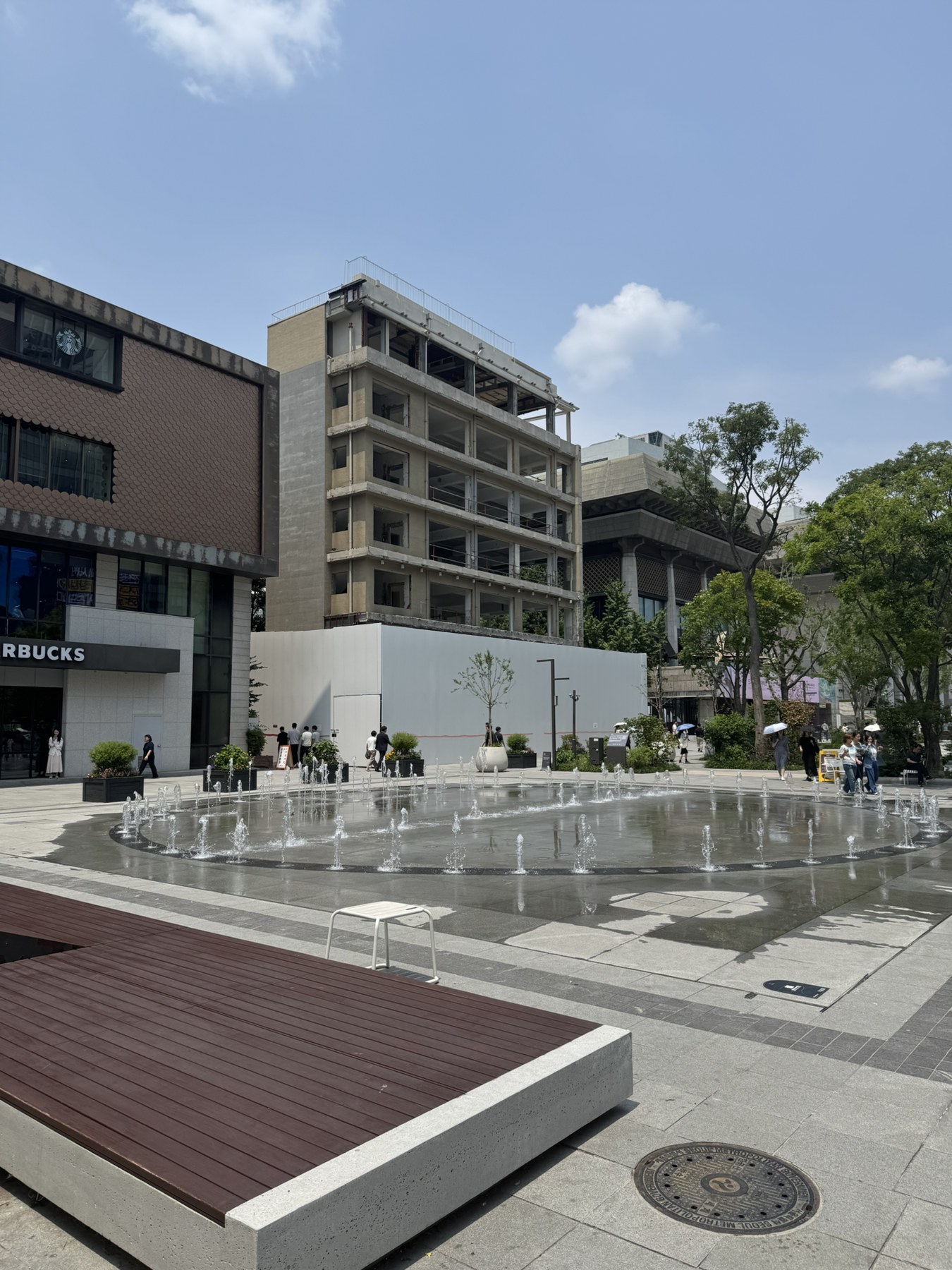 Unrelated construction site on Gwanghwamun Plaza, shown only as urban context