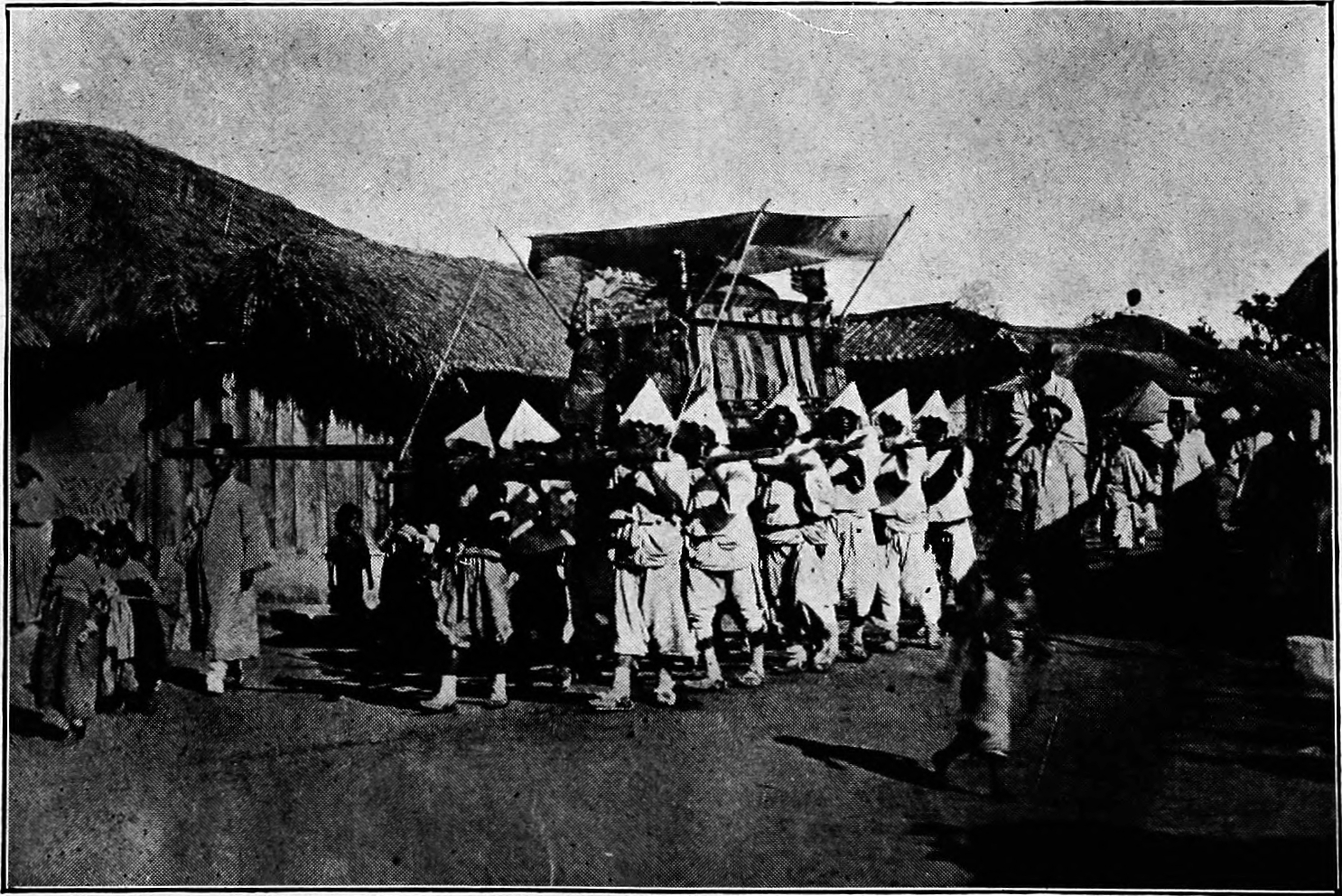 A Korean funeral procession from 1911, showing bier carriers (상여꾼) shouldering the decorated funeral bier (상여) through a village